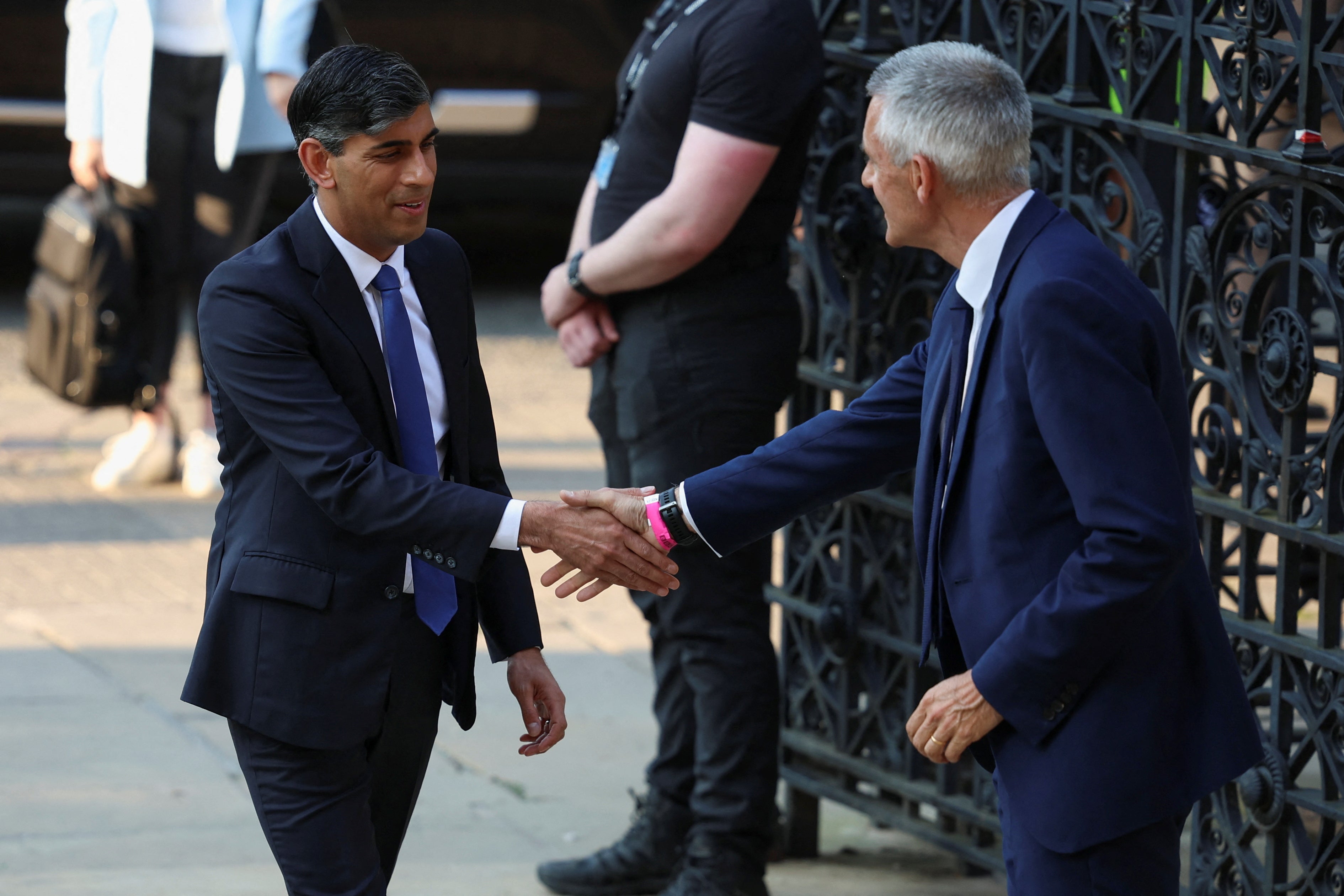 Rishi Sunak shakes hands with BBC Director-General Tim Davie, as he arrives for BBC's Prime Ministerial Debate, in Nottingham