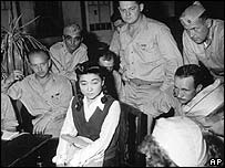 Iva Toguri D'Aquino being interviewed by US correspondents in Japan 1945