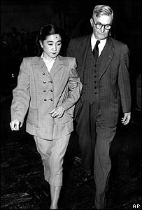 Iva Toguri D'Aquino being escorted from court in 1949