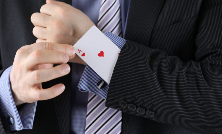 man in suit with an ace up his sleeve.x244fa1c5.jpg